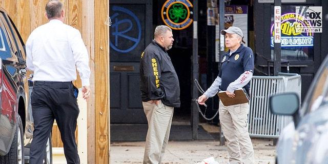 Investigators are seen outside of Reggie’s bar in Baton Rouge, Louisiana, on Tuesday, Jan. 24, 2023. The bar is reportedly one of the last places where LSU student Madison Brooks was seen before her death on Jan. 15.