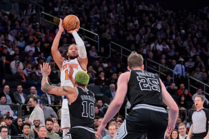 New York Knicks guard Jalen Brunson #11 puts up a shot over San Antonio Spurs forward Jeremy Sochan #10 at Madison Square Garden on January 4, 2023.