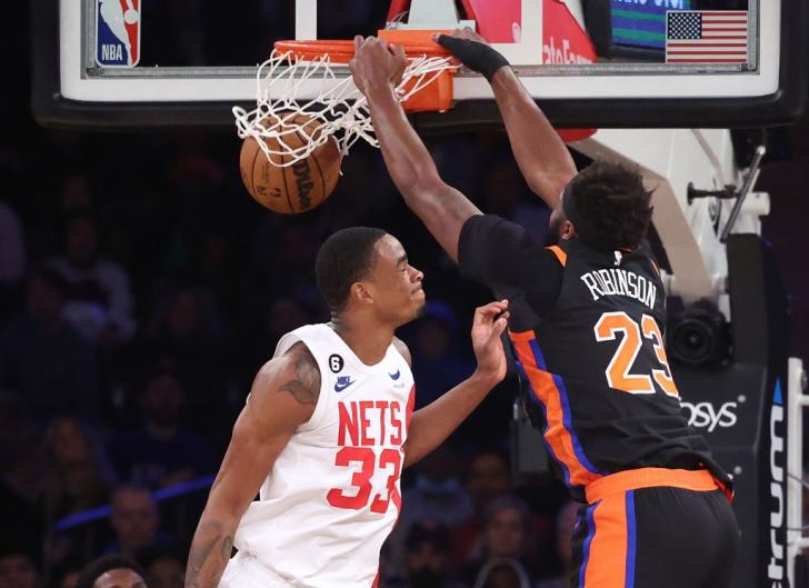 Mitchell Robinson slams the ball over Nic Claxton during the Knicks' blowout win over the Nets.